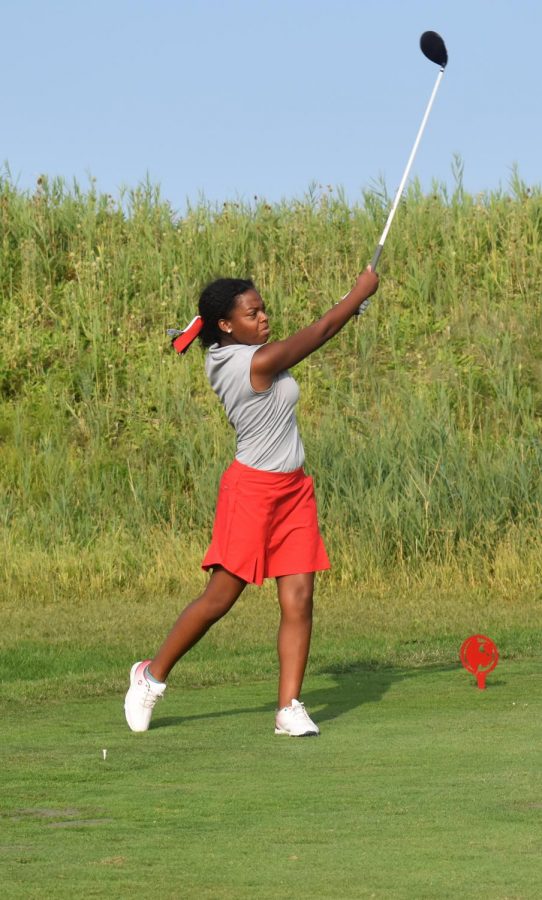 TAKING A SWING At centennial golf course, Parkyr Guiton, senior, starts the match by hitting the ball as far as she can.  The season went really well. We had such talent on the team, and it’s such a shame we didn’t make it to state,” Guiton said.
