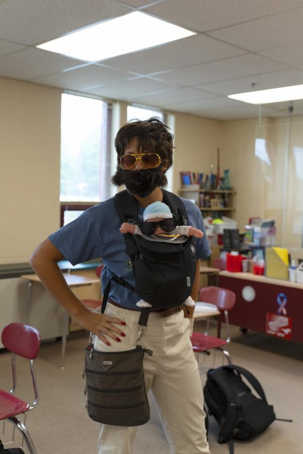 BABY ON BOARD Emma Phillips, senior, dresses as a character from “The Hangover” 
