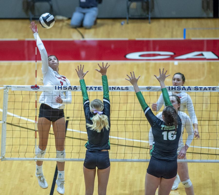 SPIKE IT At the state meet at Ball State university, Haley Melby,  junior, spikes the ball over the net. “We never stopped fighting and we made a name for ourselves in the state,” Haley Melby, junior, said.  “We proved that we belonged and that we are a big threat.”