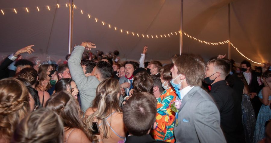 Seniors dance in the outdoor tent provided at prom night.