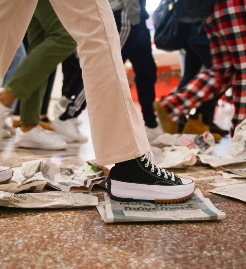 			STEPPING IT UP When papers litter the hallway, students typically walk past, not picking it up. This sense of apathy carries to other school rules deemed by the student body as 