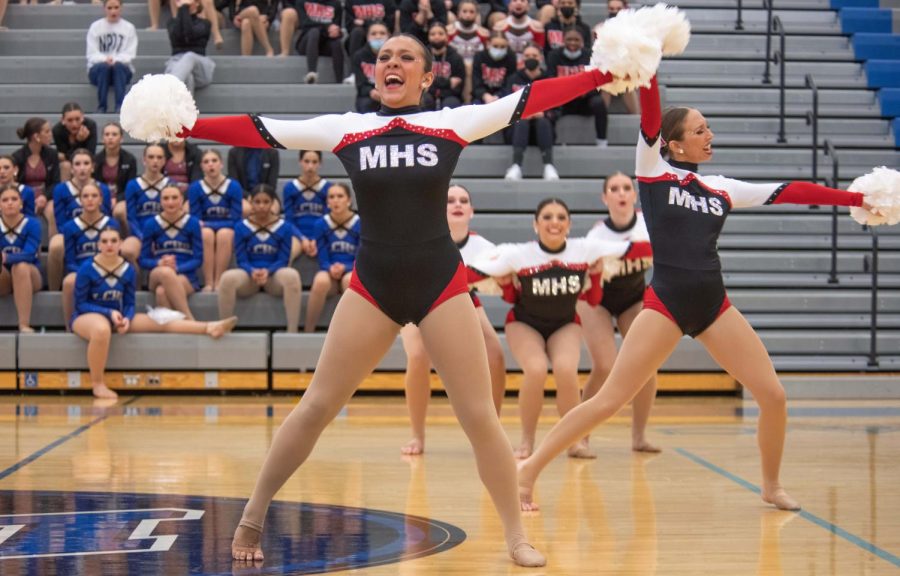 POMS OUT Posing after a hard routine, Abby Silva, senior, strikes a pose. The dance team has been very successful so far this season. “This routine definitely gives us all a chance to prove we are more than capable of winning,” Silva said.