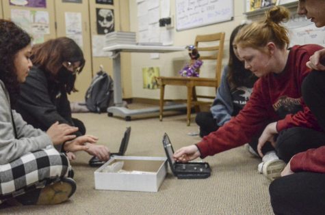 WENESDAY UNWIND Finding ways to destress after school every other Wednesday members of Munster Mental Health club sophomores Mia Cartagena, Miranda Fisher, and Lucy MacDonland junior, play a game of battleship find relief.