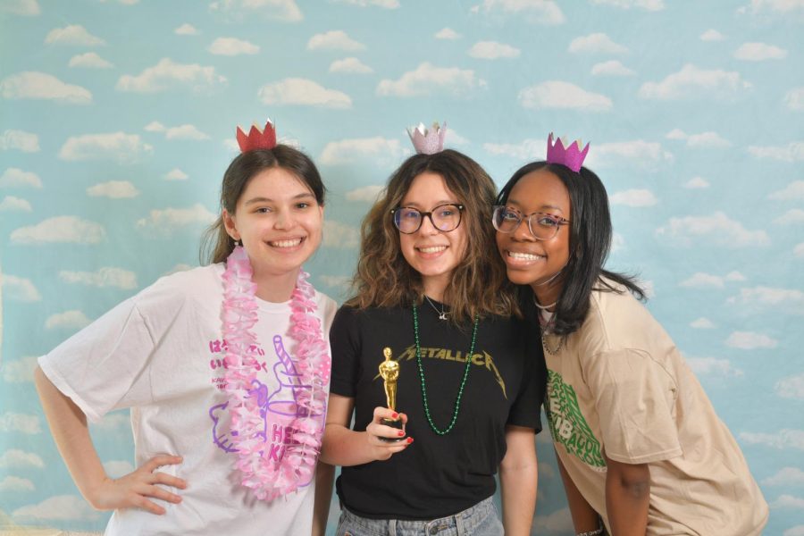 BETTER TOGETHER (right) Posing for a photo booth photo during yearbook distribution, seniors Kiki Mitrakis, Deya Meraz and Paris Marshall smile with tiny hats. “My favorite memory (from senior year) would be Homecoming spirit week,” Deya said. “It was truly the senior experience.”