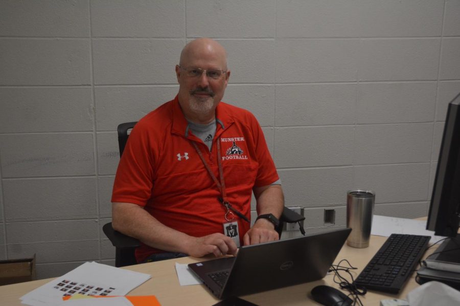 Seen in his classroom, Mr. Andrew Martin, math teacher, sits at his desk. He plans to retire after this school year.