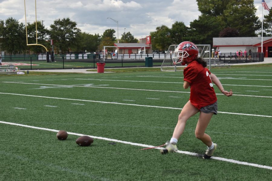 KILLA’ KICK Practicing by herself, Savannah Nuetzel, sophomore, follows through on her kick. Tonight, she will be kicking at the Homecoming game. “I get nervous before I kick because I don’t want to mess up, but I just try to remember that I make more than I miss,” Nuetzel said. 
