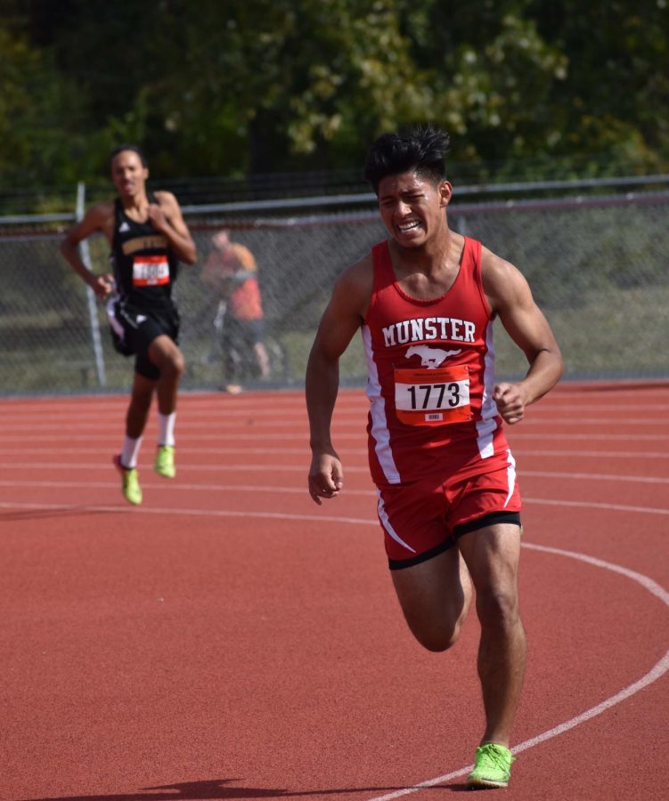 A RACE TO THE FINISH Turning the last corner of the Sectional race, Ezekiel Gomez, senior, crosses the finish line. An important goal of his being to make top 20 by senior year, he finished in19th place. “Without my teammates and coach, I wouldn’t be where I am now,” Gomez said. 