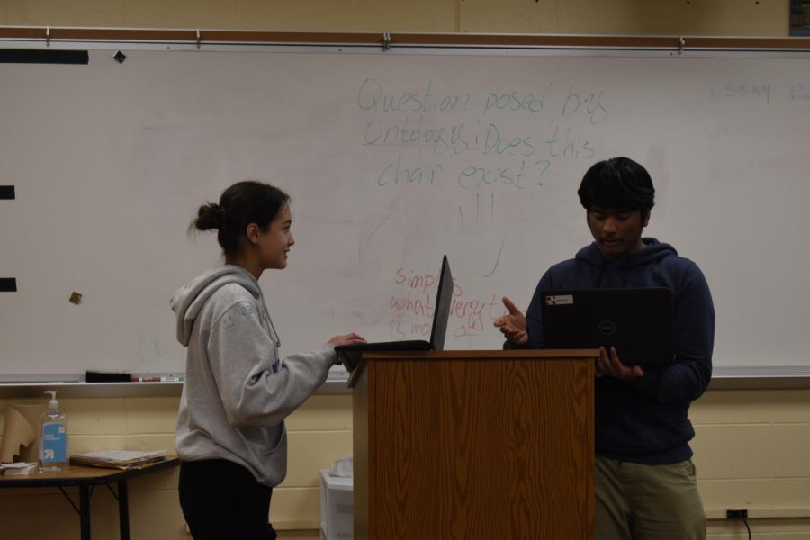 CIVIL FIGHTS In crossfire, Valeria Ceja, freshman, and Abhiram Kandregula, senior,  practice debating their Public Forum topic, ‘The United States’ strategy of Great Power Competition produces more benefits than harms.’ Topics change every few months and will change for the majority of post-season.