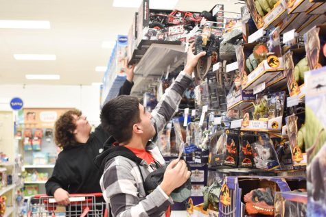 MAKING A DIFFERENCE Participating in the annual toy roundup event at Target, juniors Jackson Collard and Anthony Ornelas pick out a toy to give a child for Christmas.“I feel heroic knowing that the gifts I personally picked out will make an impact on a child’s holiday season,” Anthony said. 