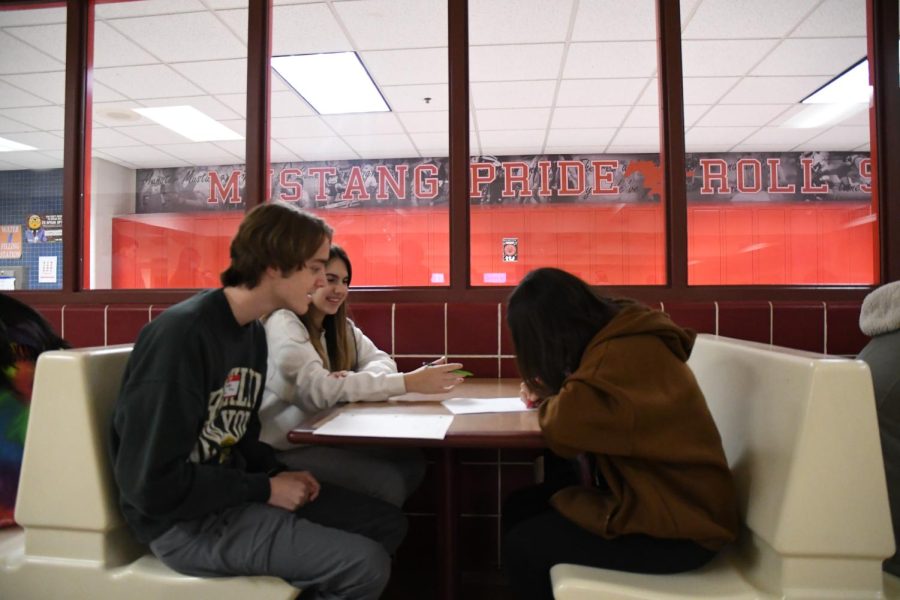 TIMELY TUTORING Staying after school, seniors, Nick Hanas and Pagie Sideris, help tutor Cynthia Ortiz, junior. “I like the opportunities I have to help people, Hanas said. 