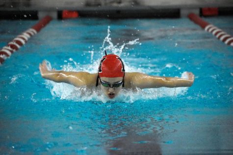 SURFACING Coming up for air, Aranxta Rivera, sophomore, finishes her stroke. Rivera swam the 100 butterfly at the team’s senior night on Jan. 19, against Lake Central. “My main focus while swimming butterfly is keeping my breathing pattern constant and for as long as possible,” Rivera said.