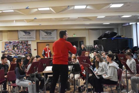 ROARING REHEARSAL MHS’ band director, Mr. Ian Marcusiu, conducting his first period band class in their practice for the upcoming competition at ISSMA. The band students have spent all year working hard on improving their skills in the hopes that they will succeed in this competition. 
