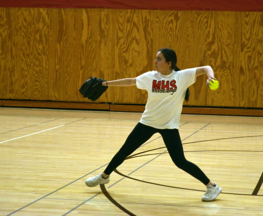 PLAY BALL During practice, Giana Gallardo, sophomore, throws the ball to her drill partner.