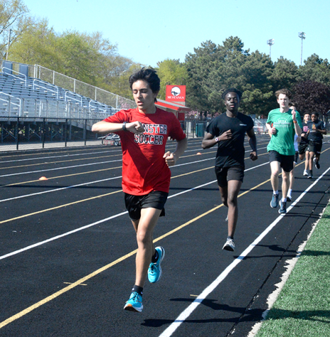 LINED UP Running laps, sophomores Ashton Silva and Kwaku Awuah exercise their endurance for track. Despite many of the members sustaining wounds throughout the year, the Boys’ Track has been working hard to overcome their injuries and succeed in the future.