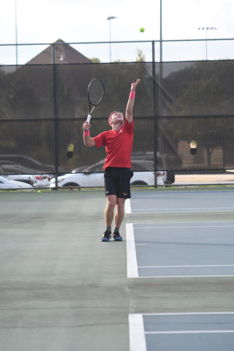 WINDING UP During Sectionals, Adam Muntean, senior, serves the ball to the opposing Valparaiso team. “It was a very fun but challenging season, especially because I was injured for all of it,” Muntean said. “The team had a bond this year that was awesome.” 