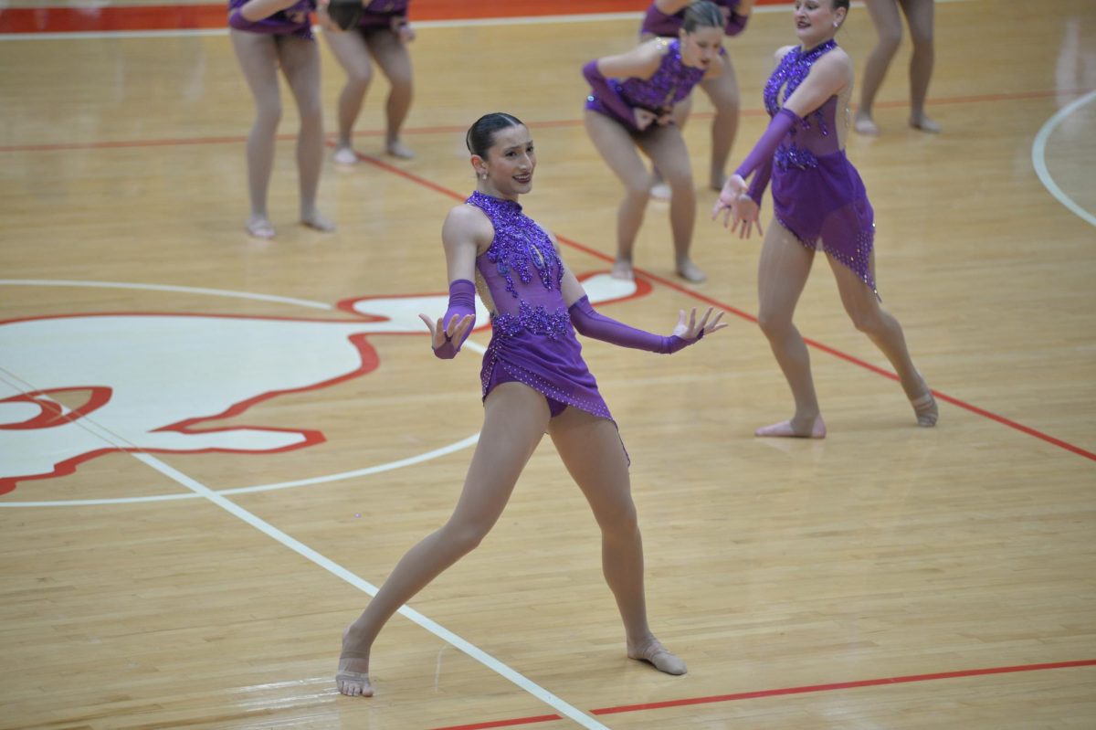 JUST DANCE  Performing at halftime, Sam Bleza, junior, uses facial expressions to contribute to her performance. Bleza was recently crowned 2024 Senior Solo State champion. “When I won State solo, it was the most unreal feeling ever,” Bleza said. “I was so proud of myself.”