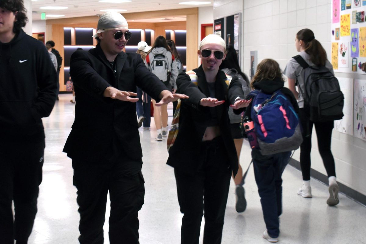 DONT STOP THE PARTY Dancing through the halls, Joaquin Magallanes and Gillian Farley, navigate their way to second period both dressed as Pitbull. (photo by marianna young)