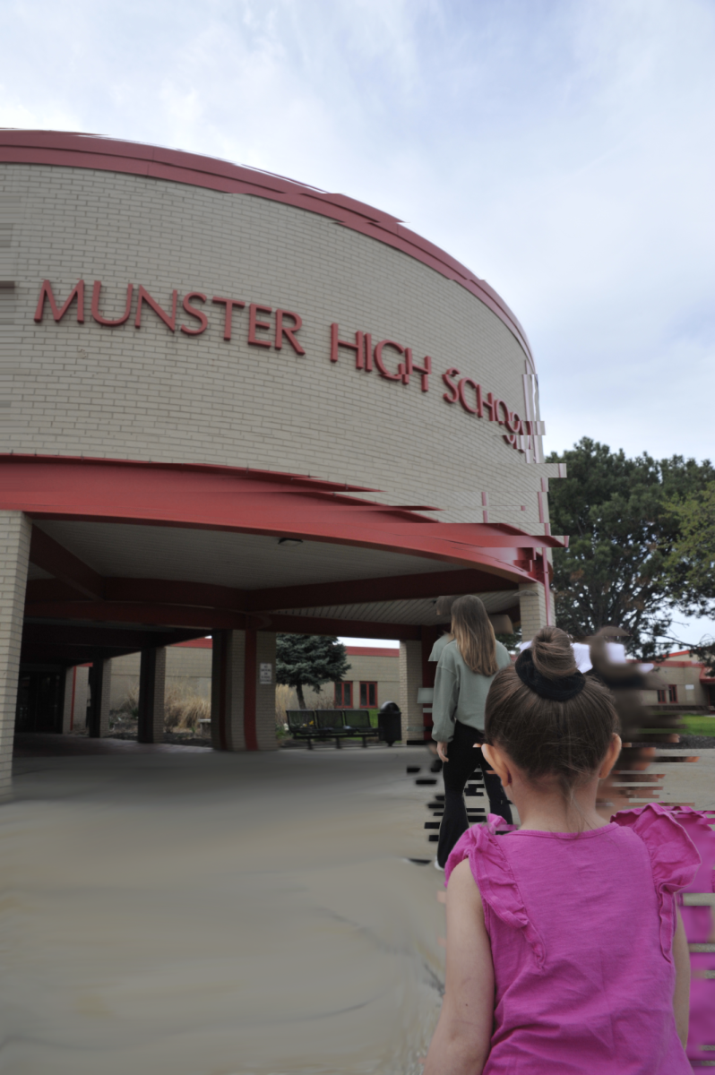 LOOKING INTO THE FUTURE In front of Munster High School, Aubrie Gerstenberg watches her older sister, Emilie Gerstenberg, senior, enter the school that she will attend in ten years. The sisters are twelve years apart from each other.