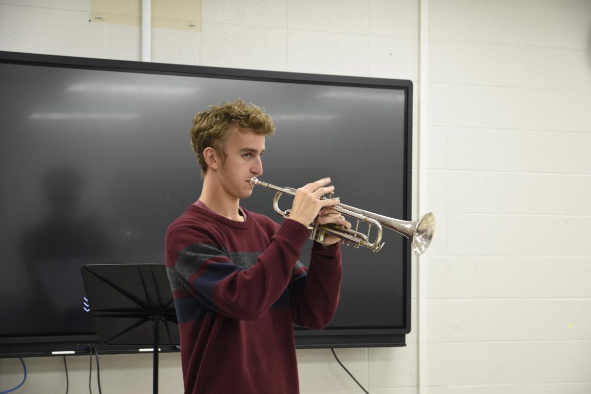 JAZZ IT UP After school in the middle school band room, Mr. Nolan Lehman, band director, plays “Happy Birthday” on his trumpet. 