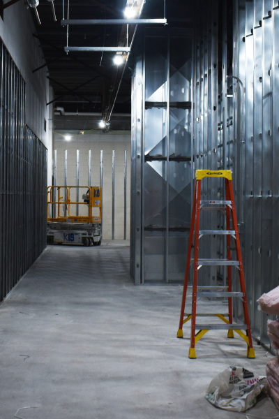 LAY THE GROUNDWORK Iron beams lining the halls, the upstairs music room is early in its construction phase. According to principal Morgan Nolan, the choir room floors will be insulated with rubber and will have double walls to suppress sound.