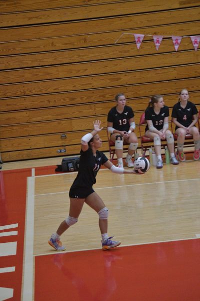 A STRIKING SERVE In the air, senior Liliana Rivera serves the ball performing a jump serve. The girls volleyball team had their cancer awareness game on Oct. 2nd against Portage. The Mustangs won 3-0. “I try to keep myself as loose and calm as possible on the court, because I usually get in my head,” Rivera said. 