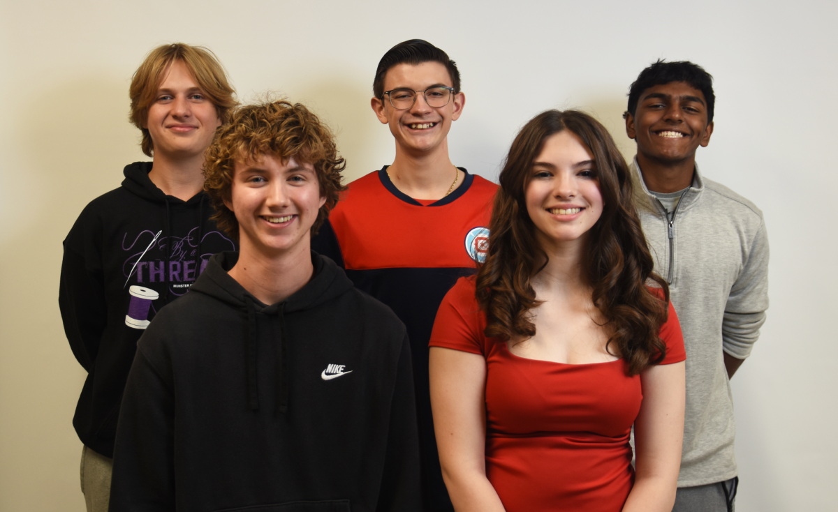 WE’RE AN HONOR Posing for a photo, freshman Olivia Mack and juniors Ben Coble, William Keegan, Jovi Savaglio and Raghuram Subramanian smile together. 