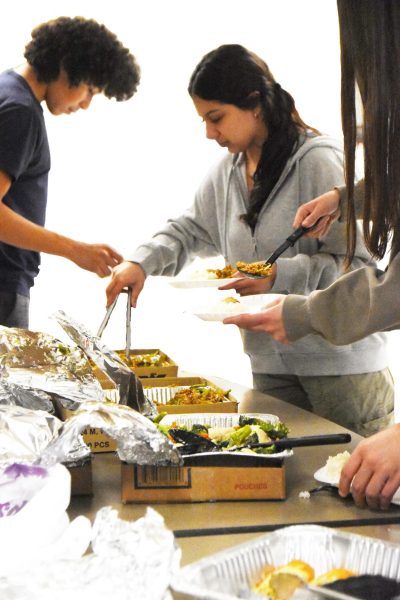 DISH IT OUT Selecting their food, junior Mia Zuniga and freshman Benjamin Castillo-Mendoza dish their plates. 