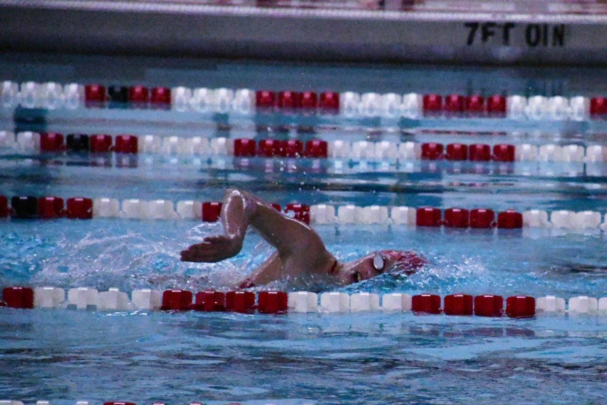 UP FOR AIR Swimming freestyle, freshman Lilly King competes in the 200 freestyle. For each event, swimmers will have a goal or focus for their race. “I focus a lot on kicking and on my turns being fast, and my breathing,” King said.