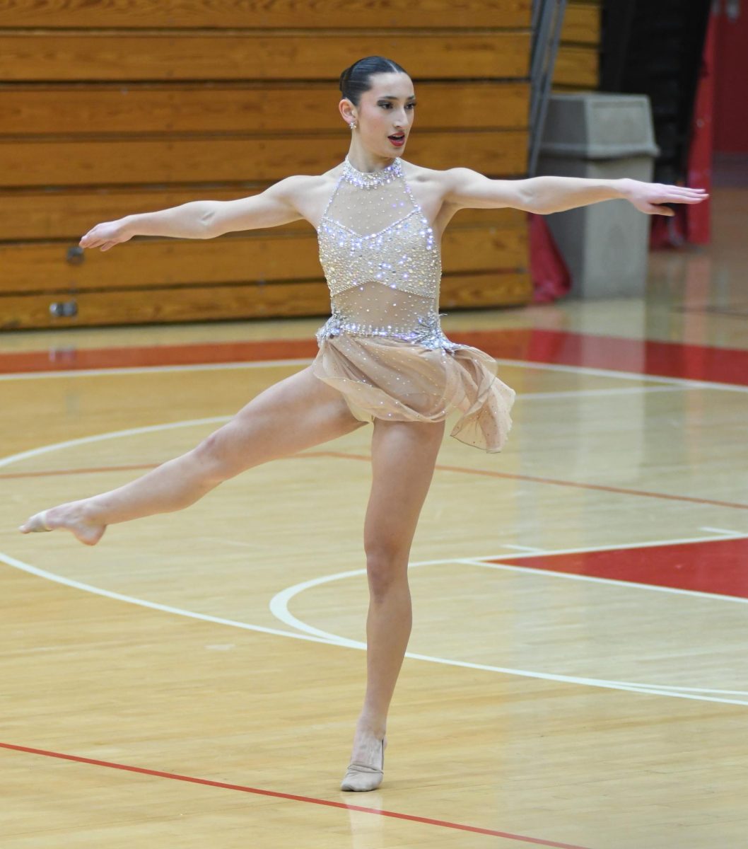 ONE LAST DANCE Performing her senior solo routine at the dance showcase Dec. 2, Sam Bleza and the dance team perfect their competition routines. “We showcased our routines to family and friends,” said Bleza. “Now, all of our practices are just preparing for our next competition.” 