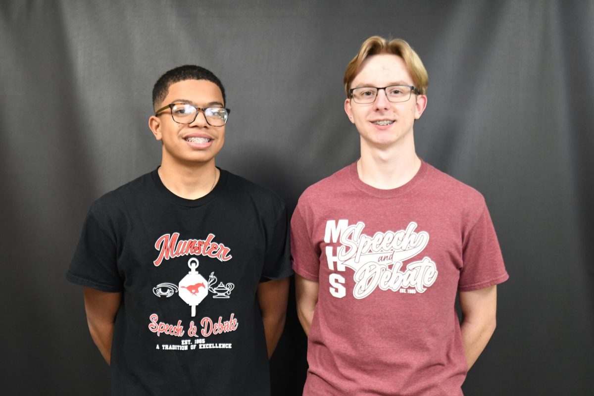 TALK THAT TALK Posing for a picture, juniors Brandon Walker and Derek Kenning smile for the camera. The two juniors will travel to Des Moines, Iowa in June for the NSDA National Tournament. 