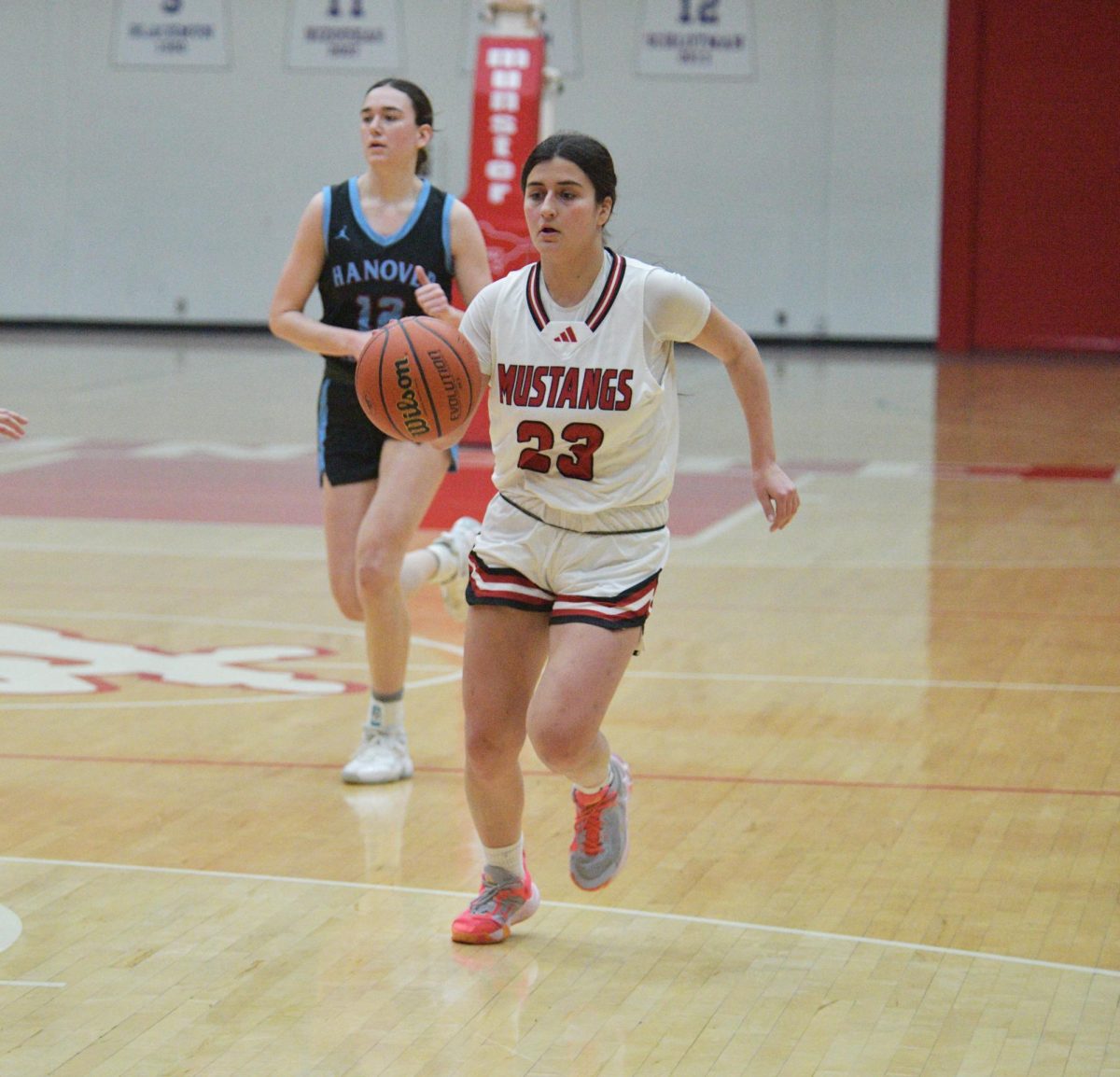 CONQUER THE COURT Competing against Hanover, senior Lia Sotiropoulos dribbles the ball down the court on offense. “We have been training really hard, conditioning and tailoring our defense to play Lake Central,” Sotiropoulos said. (Photo by Ben Schirz)