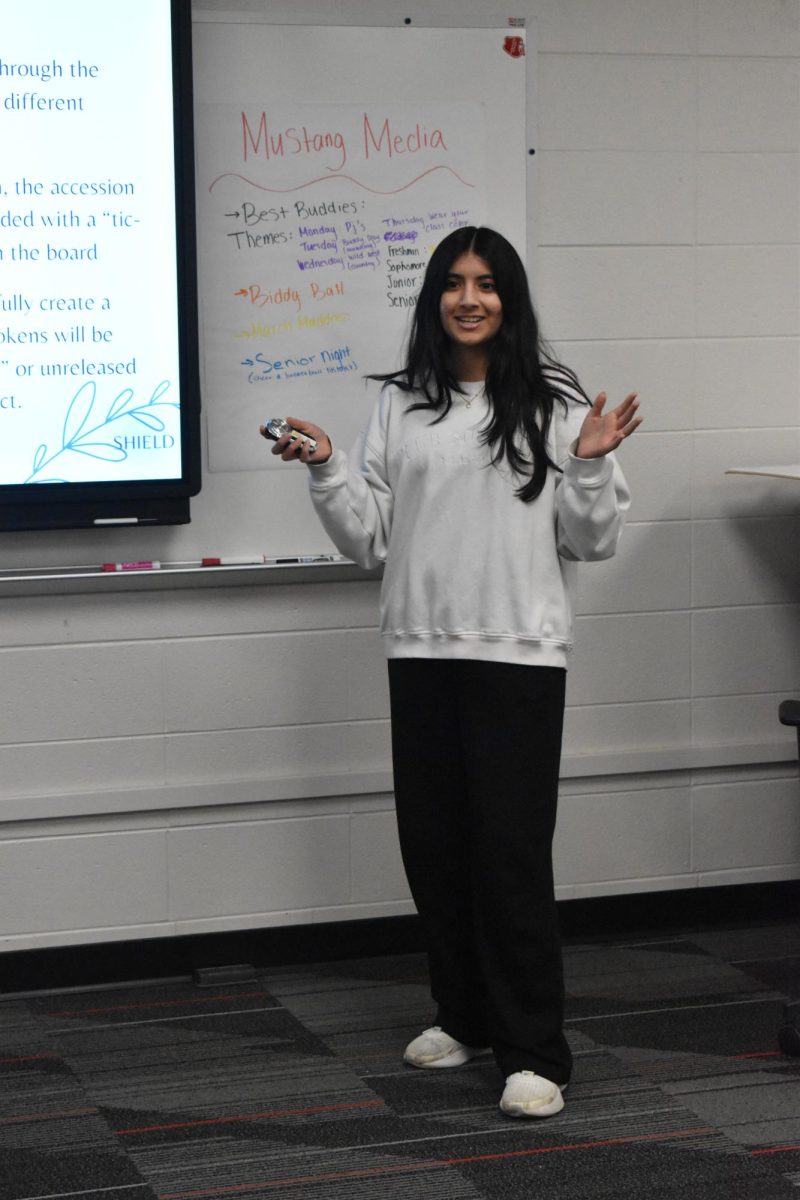 SO FRESH, SO CLEAN Presenting to Kristin LaFlech, junior Dhara Patel pitches her DECA project on a potential deodorant product. Her group members plan to have a booth selling their product, Shield, in a few weeks to have students test the   product. “People should buy this product because everyone deals with sweat stains at least once and there’s no product out there that really eliminates that problem completely,” Patel said. “So our idea is to create a three step ‘skincare’ routine by taking a consultation, so the ingredients are personalized to your needs."