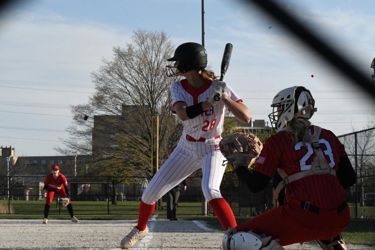 BATTER UP Preparing for the next ball, senior Morgan Kindy watches the pitcher in batting position. At this game against Kankakee Valley, the varsity softball team won with a score of 11-1.