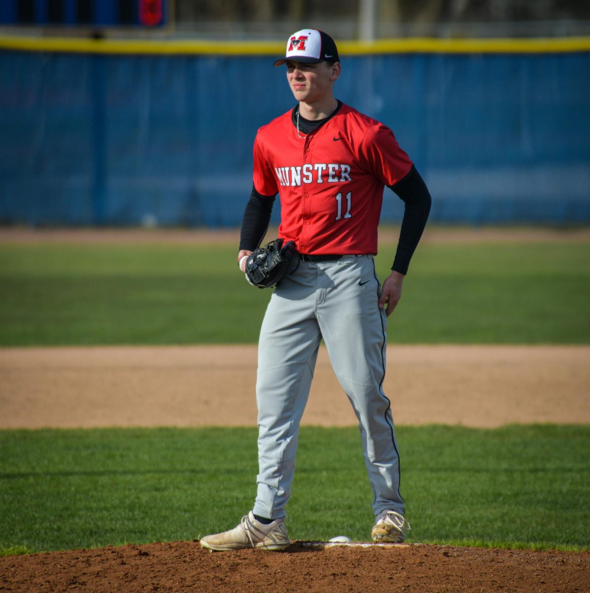 LOCKED IN Staring down the batter, senior Tyler Fuller pitched against Highland. The team won 17-6 on April 14. “I was dialed in and trying to throw as many strikes as I can,” Fuller said. “I was really just thinking about my approach to getting each batter out.” 
