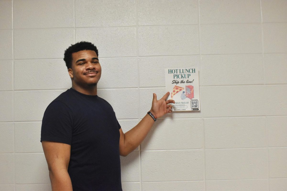 Standing in the hallway, senior Genesis Greenwood points to a Well Chew poster. Around the school, students can see these posters and use the scan code to access the sign up sheet. “I will be there for the whole process,” Greenwood said. “ABC all together, so I can't wait to see what it’s gonna be.”