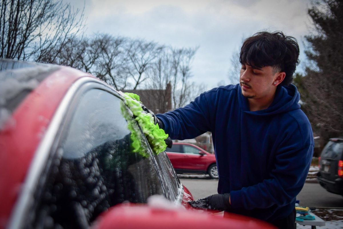 RAIN OR SHINE Washing a clients car, senior and founder of Kathari Detailing Aris Karountzos built the company from the ground up with a passion for automorive care and premier customer service. "I always enjoyed the process of cleaning cars." Karountzos said. "So I thought, why not make a businesss out of it."