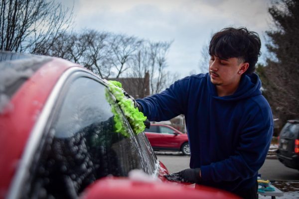 RAIN OR SHINE Washing a clients car, senior and founder of Kathari Detailing Aris Karountzos built the company from the ground up with a passion for automorive care and premier customer service. "I always enjoyed the process of cleaning cars." Karountzos said. "So I thought, why not make a businesss out of it."  