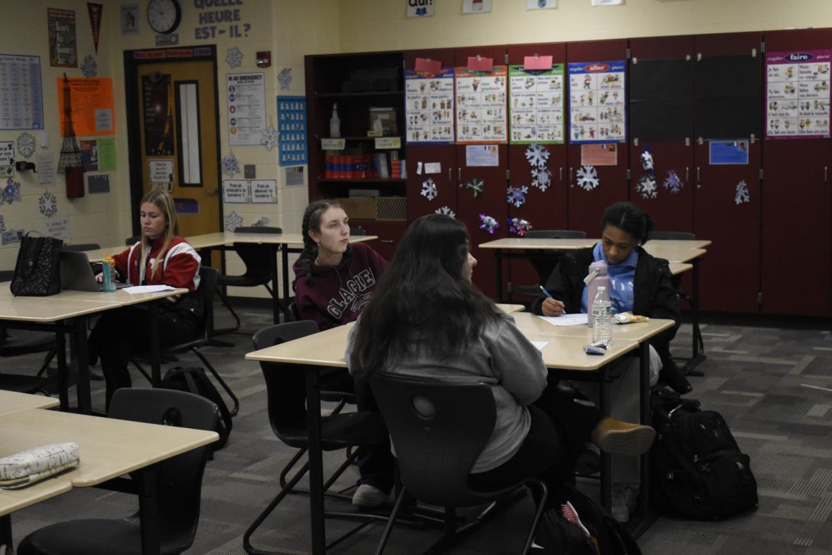 CLASSE DU JOUR Working on their class-work, French V students listen to French music released this year for the upcoming music tournament "Manie Musicale." "I actually want to minor in French because I really, really do like the language," 