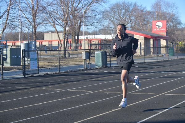 KEEP YOUR HEAD UP Running on the track, senior Shavar Billups practices sprints. The track team practices everyday after school preparing for their indoor season.  