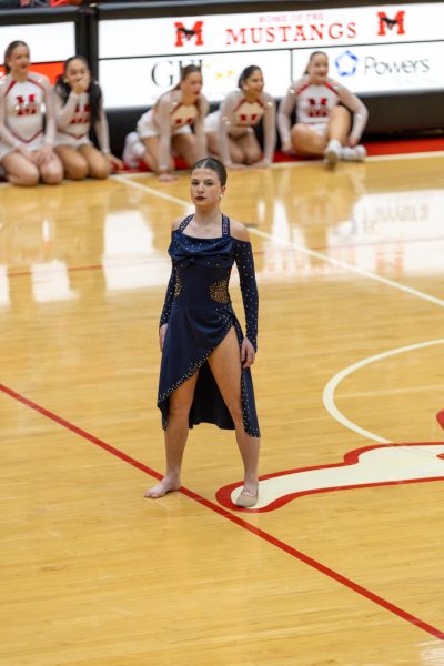 IN THE SPOTLIGHT Performing at halftime, freshman Alexis Cronin and Arianna Vrehas carry out their routine. The dance team recently competed in the NDA Nationals Championship in Orlando, Florida Feb. 14-16. 