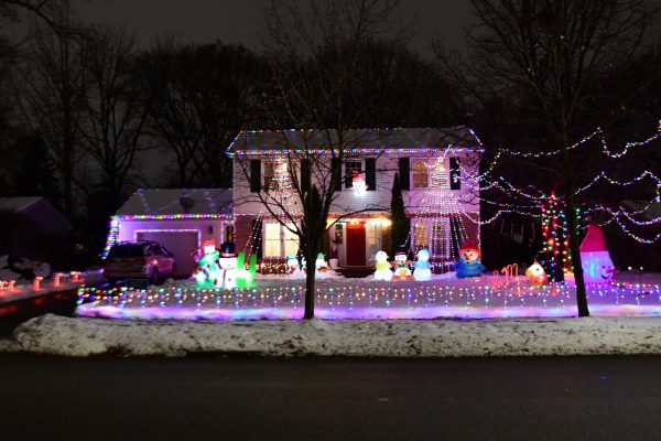 WINTER WONDERLAND As a part of the town-wide decorating contest, junior Brennan Rommelfanger competes against the Forsyth family. “The Forsyths and my family are both baseball families,” Rommelfanger said. “We used to be throwing partners, so we have a good time trying to win.”