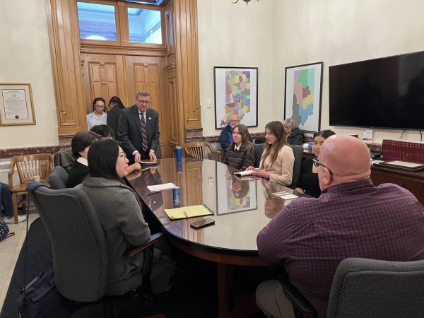 ALL VOICES MATTER Around the table, junior Audra Cabiness, senior Grace Wang, science teacher Michael Bakker, sophomore Nina Hestjean, senior Claire Piriczky and senior Eileen Eriks discuss with state representative Mike Andrade. Members discussed data centers being built in northwest Indiana and their effects on the environment. 